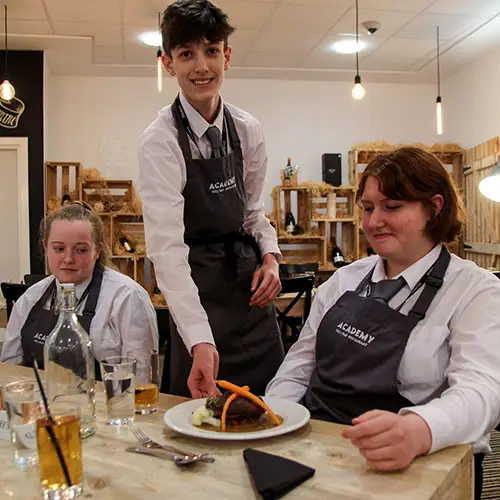 Hospitality student serving customers