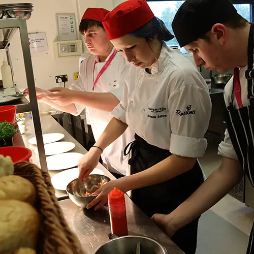 Catering students preparing food