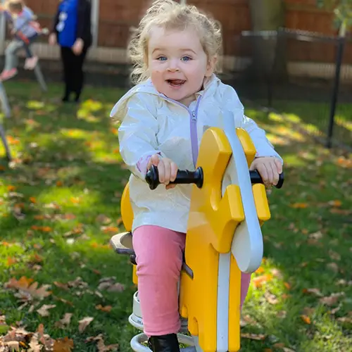 Starting point nursery girl on swinging horse