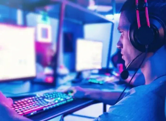 man staring intently at a computer screen