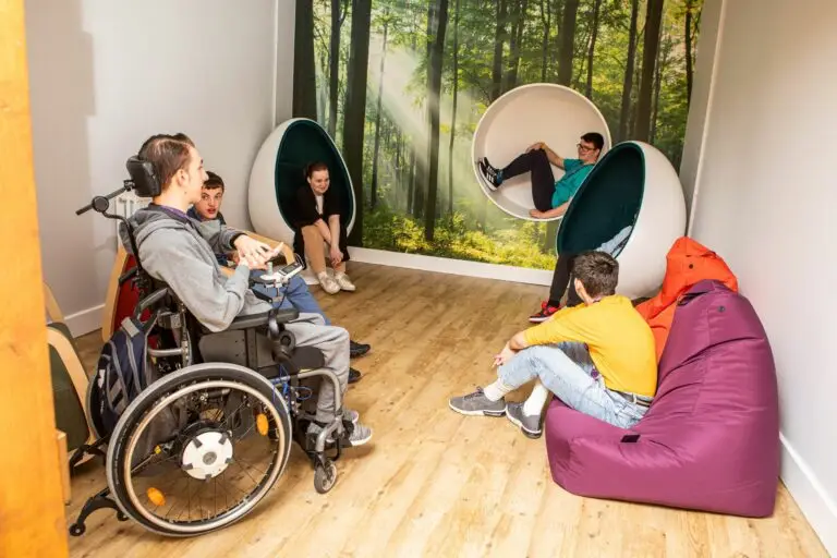 students in a classroom with egg chairs and bean bags